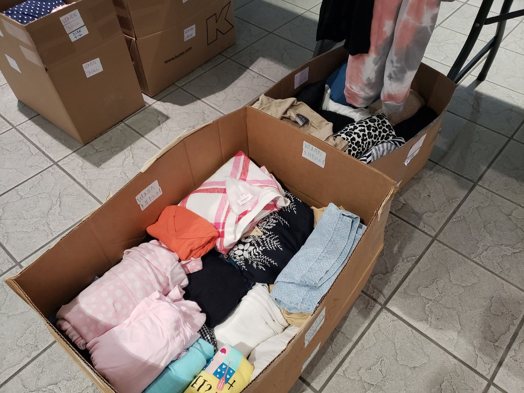 Women’s clothing sorted in boxes