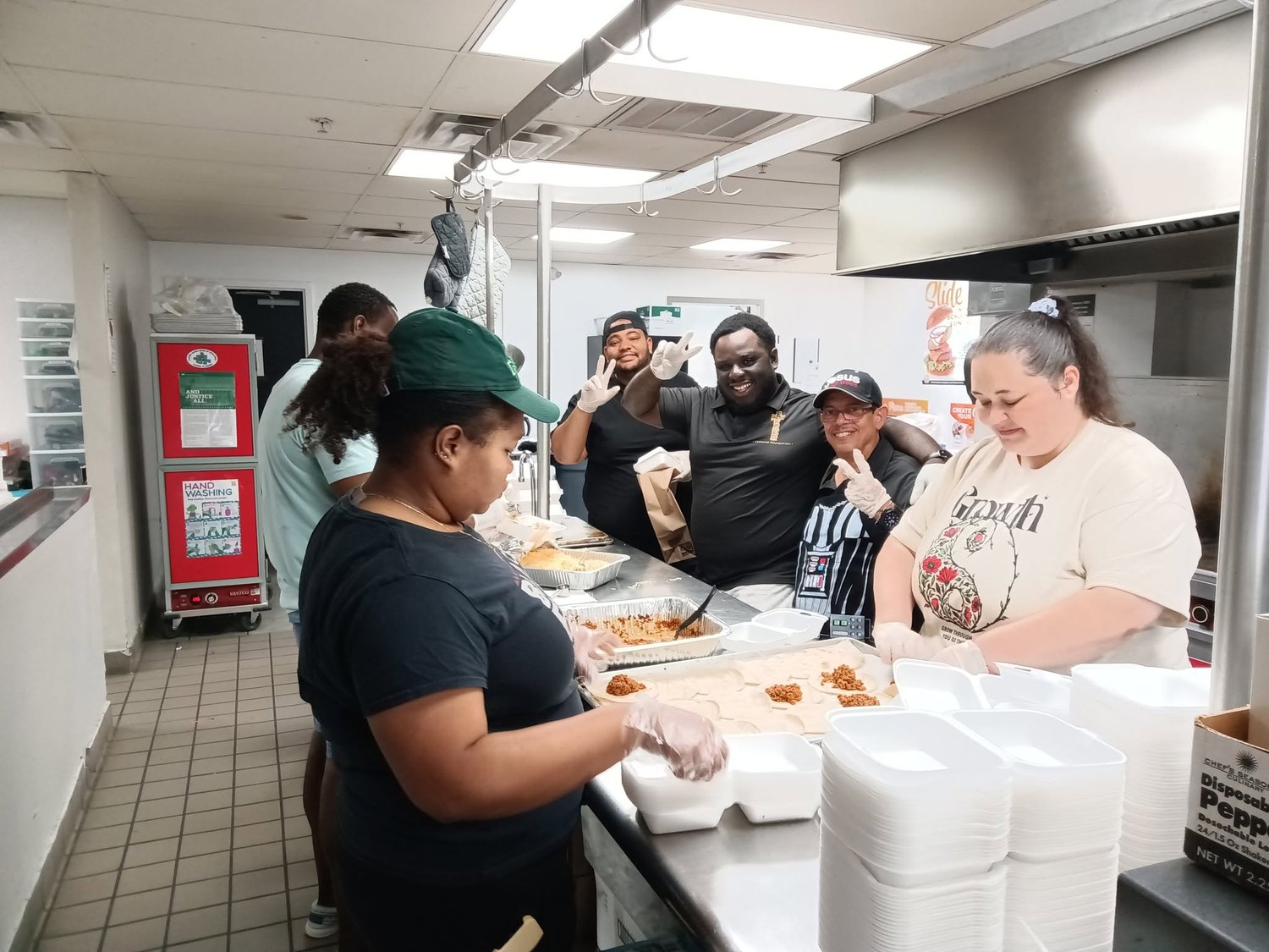 FFF volunteers packing meals together