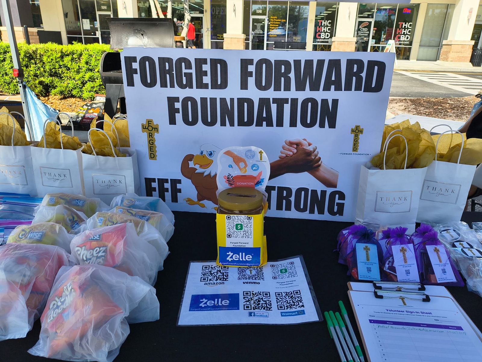 FFF outreach booth close-up with donation and volunteer information