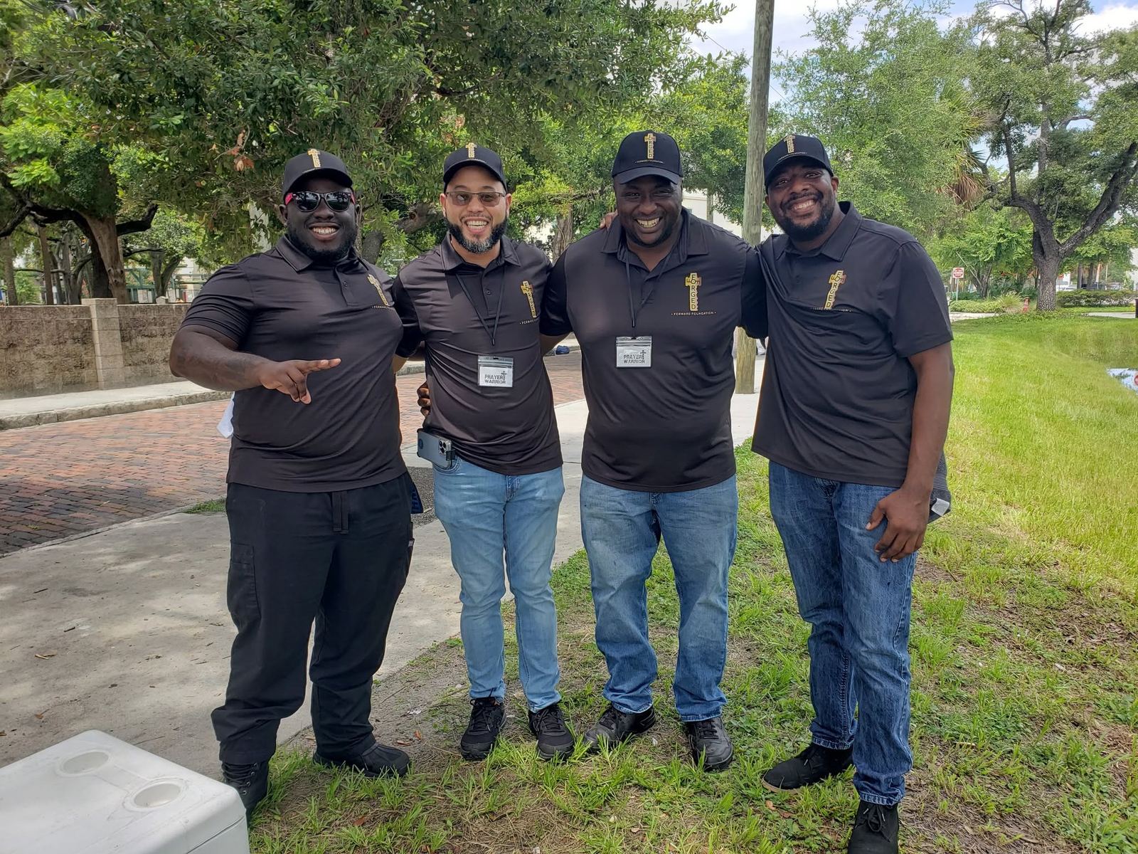 FFF leadership team smiling together outdoors during outreach