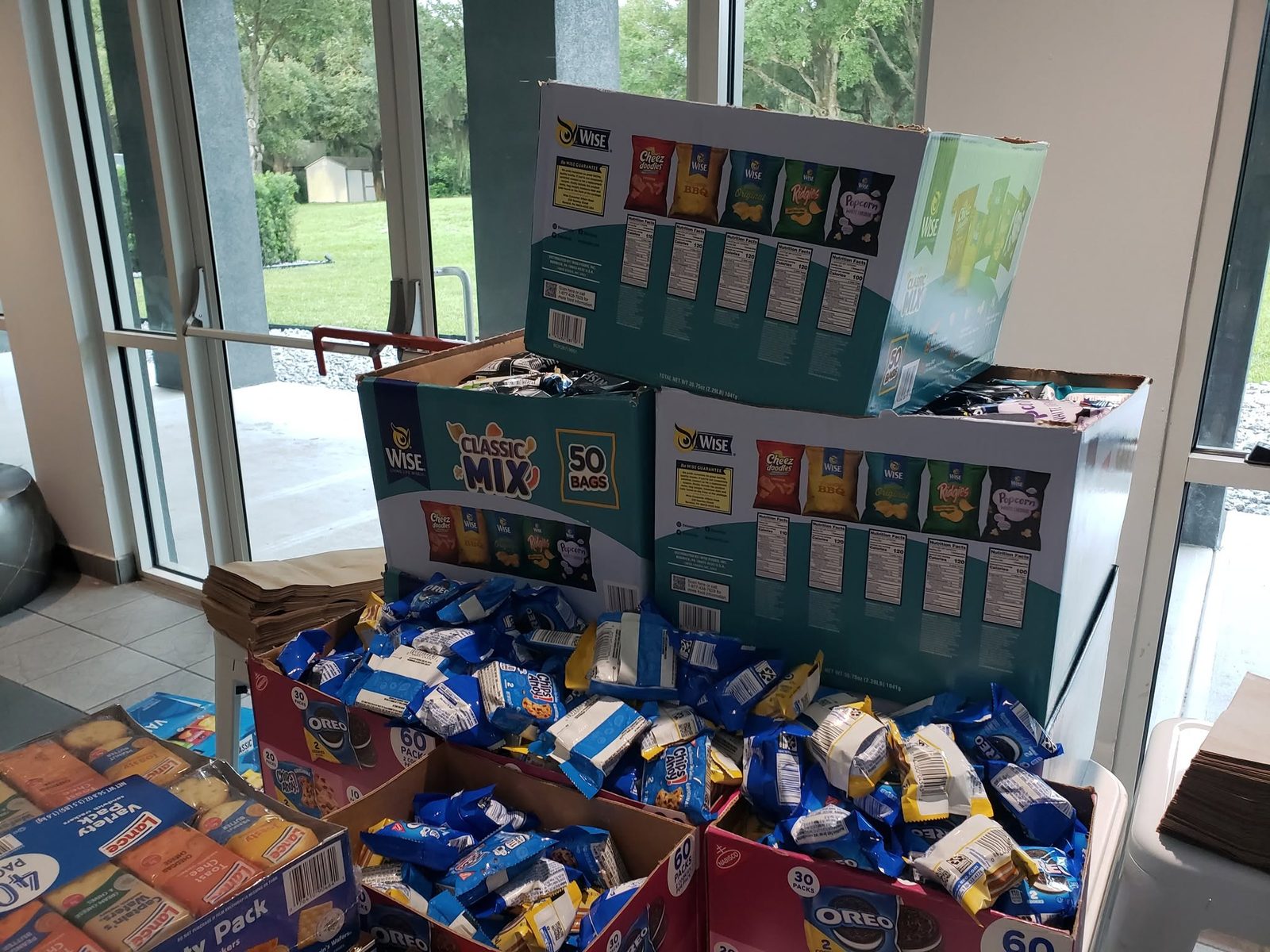 Snack donations displayed for outreach supply bags