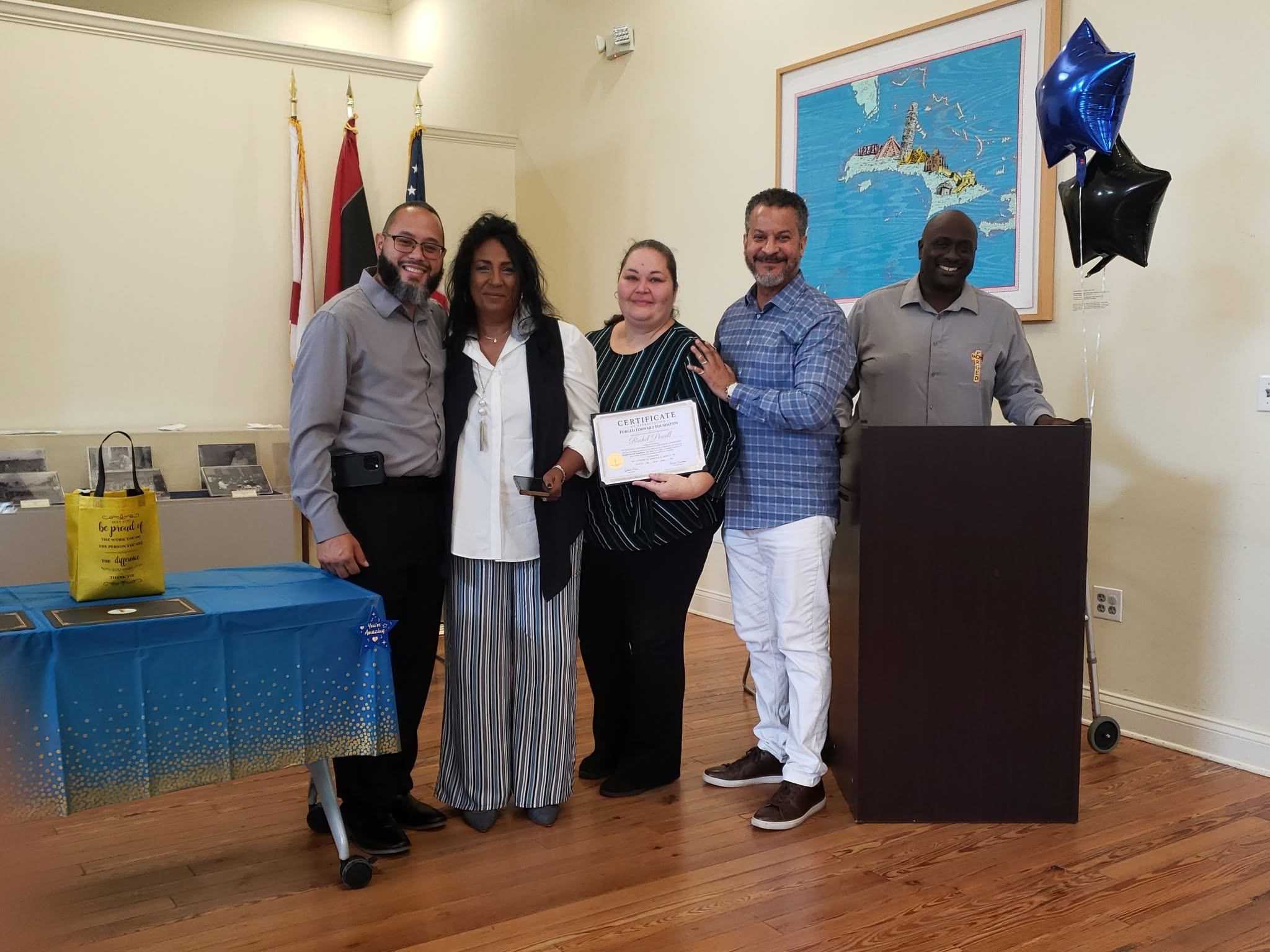 Rachel Powell holding her FFF certificate during a recognition ceremony
